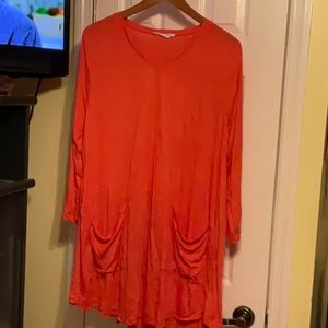 Pop of orange long tunic very cute. Lula B